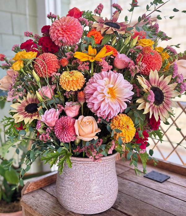 Joyful Regal Floral Arrangement with dahlias, sunflowers, roses, marigold, rudbeckia, and more.